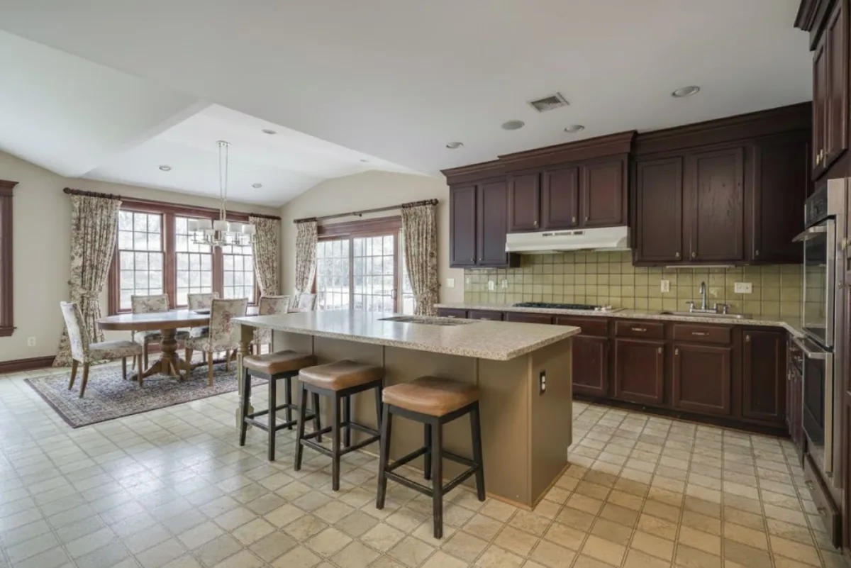 Kitchen before renovation — dated and tired